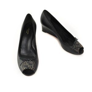 GUCCI: Black, Leather & "GG" Logo Peep-Toe Wedges